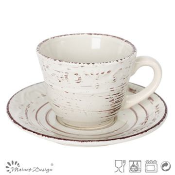 En relieve con Antique Brush Conjunto de platillo y taza de té a granel